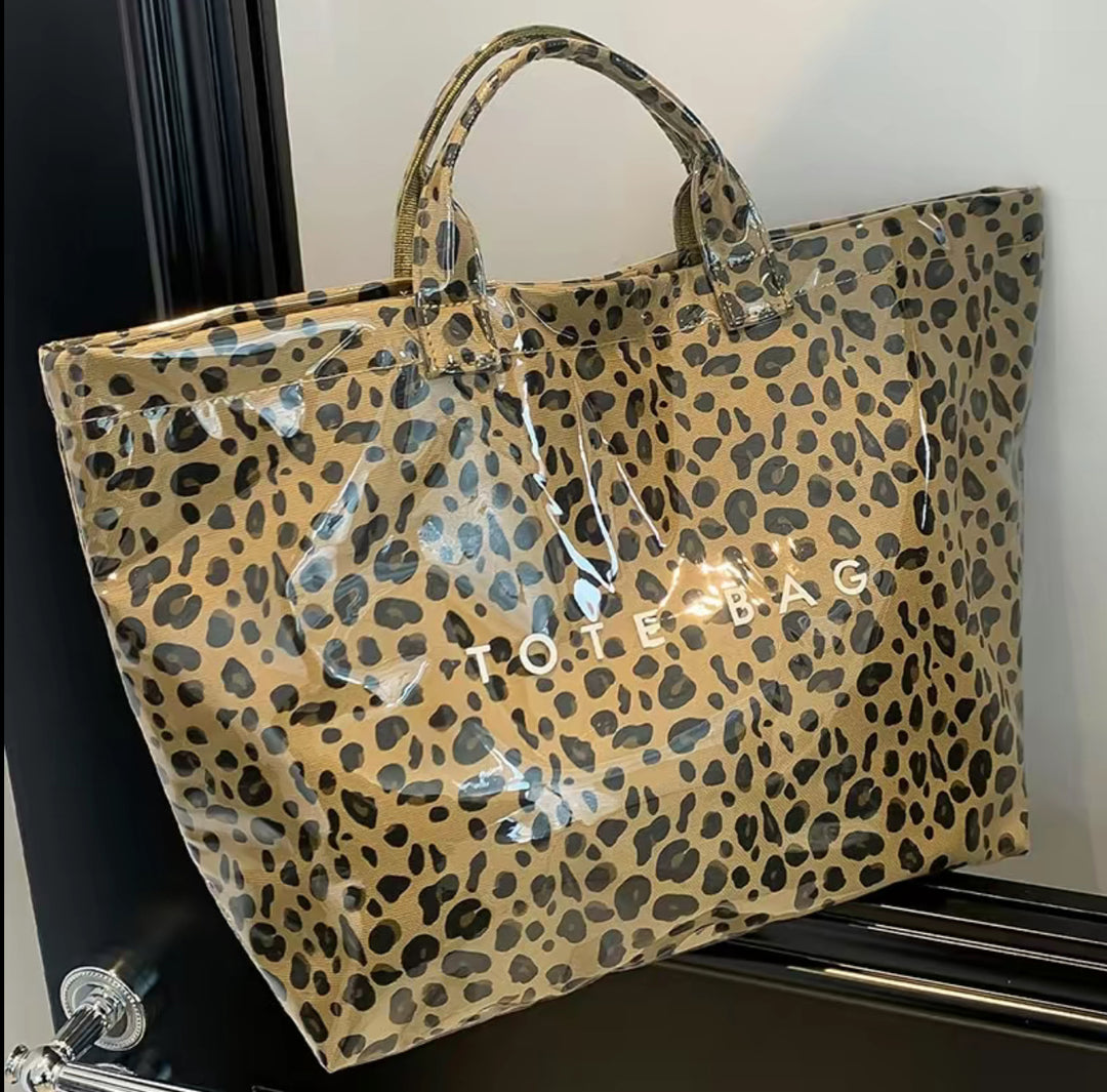 Glossy Vintage Tote Bag with bold leopard print and "TOTE BAG" in white. Available in S, M, and L sizes.