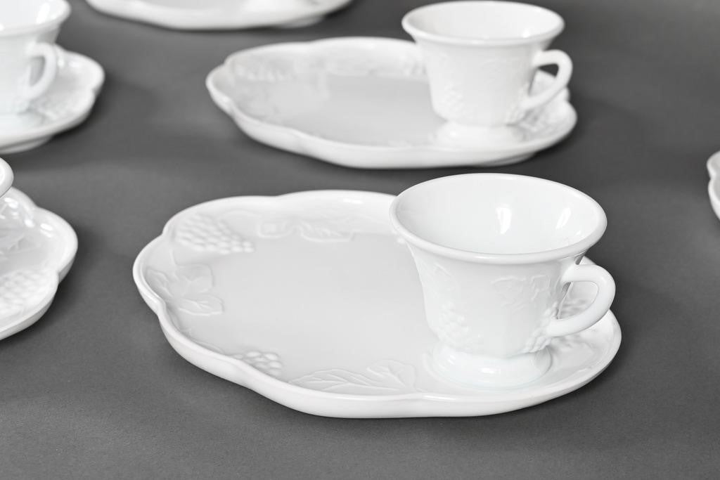 Glossy white milk glass snack plates and cups with embossed grape and leaf patterns, scalloped edges. Available in 8" and 10".