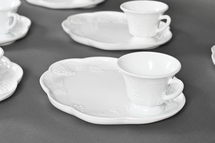 Glossy white milk glass snack plates and cups with embossed grape and leaf patterns, scalloped edges. Available in 8" and 10".