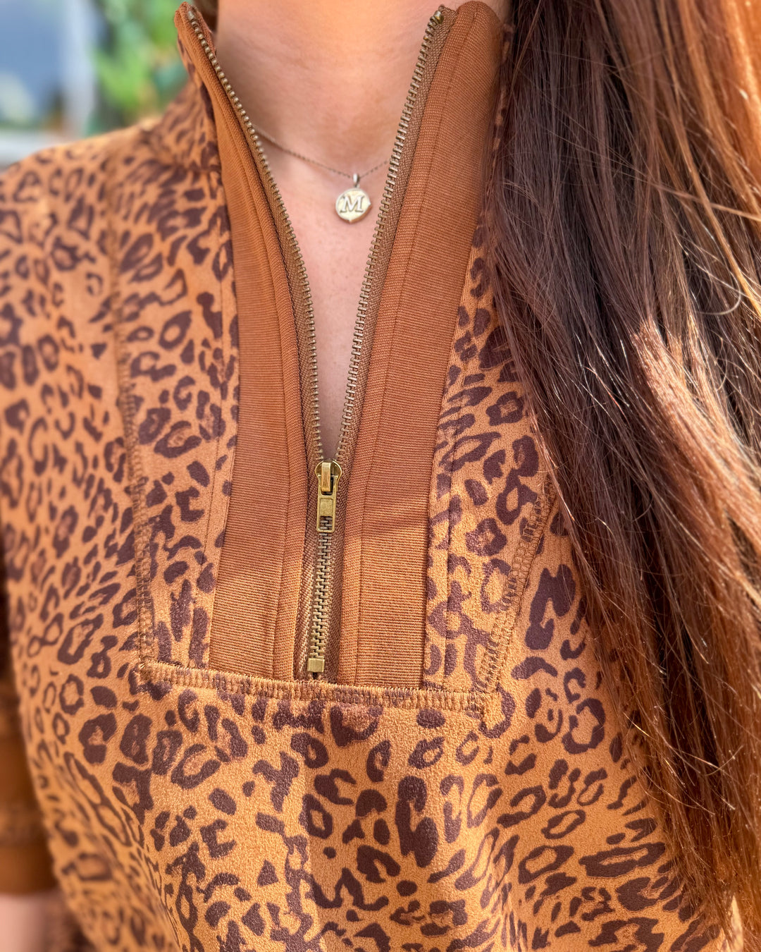 Leopard Zip-Up Top with bold animal print pattern. Available in sizes XS-XL.