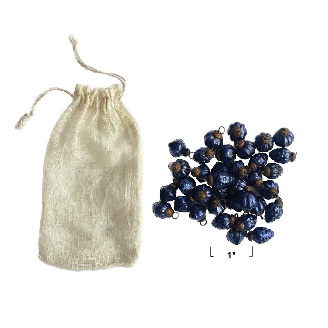 Embossed recycled blue mercury glass ornaments in a muslin bag, one inch size.