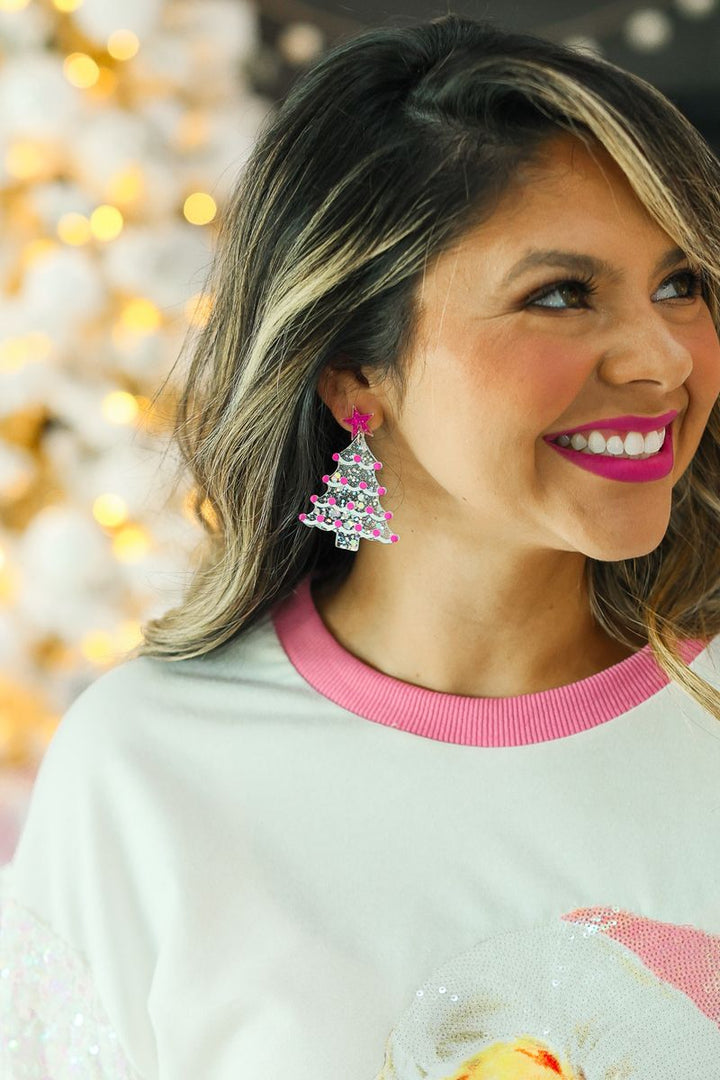 Silver and pink Christmas tree earrings with pink accents and a small pink star topper.