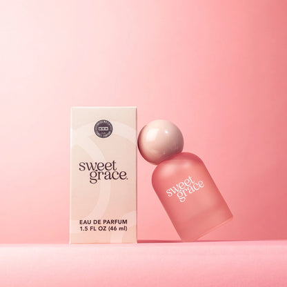 Sweet Grace Eau de Parfum, 46 ml. Light pink box, white text, minimal design. Subtle patchouli notes. Available size: 46 ml.