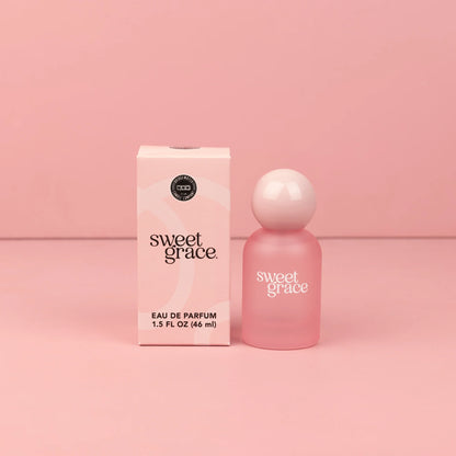 Sweet Grace Eau de Parfum: Frosted pink bottle with matching box. Scent features patchouli and passion fruit notes. Available in 8 oz and travel 0.34 oz sizes.