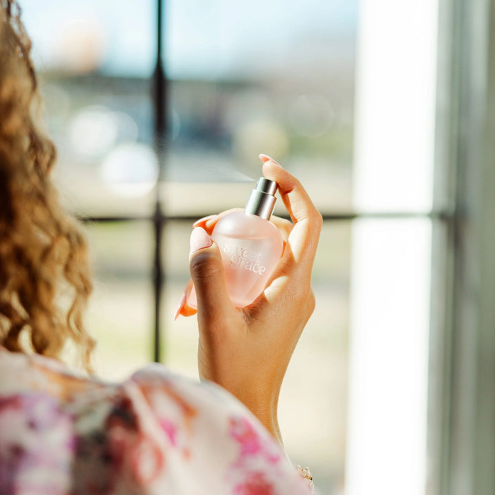 Sweet Grace Eau de Parfum in a clear bottle with a silver cap. Available sizes: 8ml, 30ml, 100ml.
