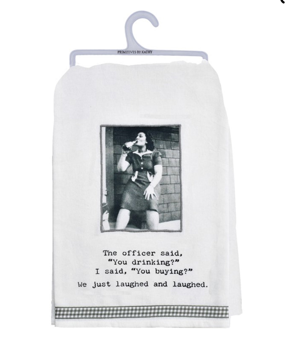 Black and white kitchen towel with witty phrase: “The officer said, ‘You drinking?’ I said, ‘You buying?’” Available in multiple sizes.