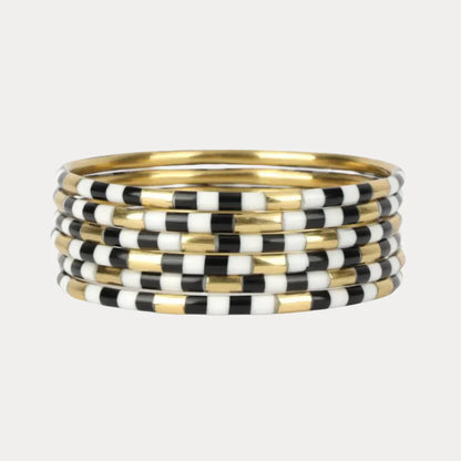 Set of seven thin enamel bangles with black and white checkerboard pattern, available in multiple sizes.