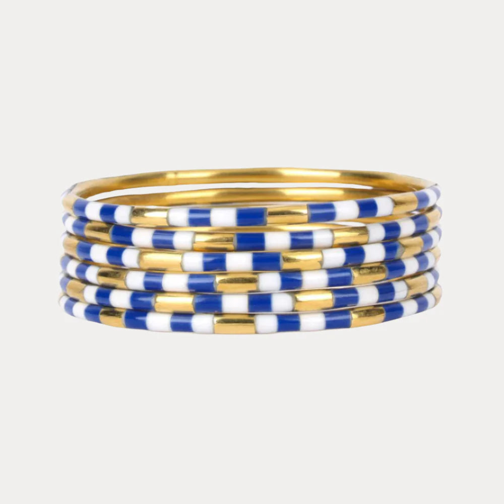 The Blue & White Veda Stack: seven BuDhaGirl bangles with blue and white enamel accents. Available in S, M, L, XL.