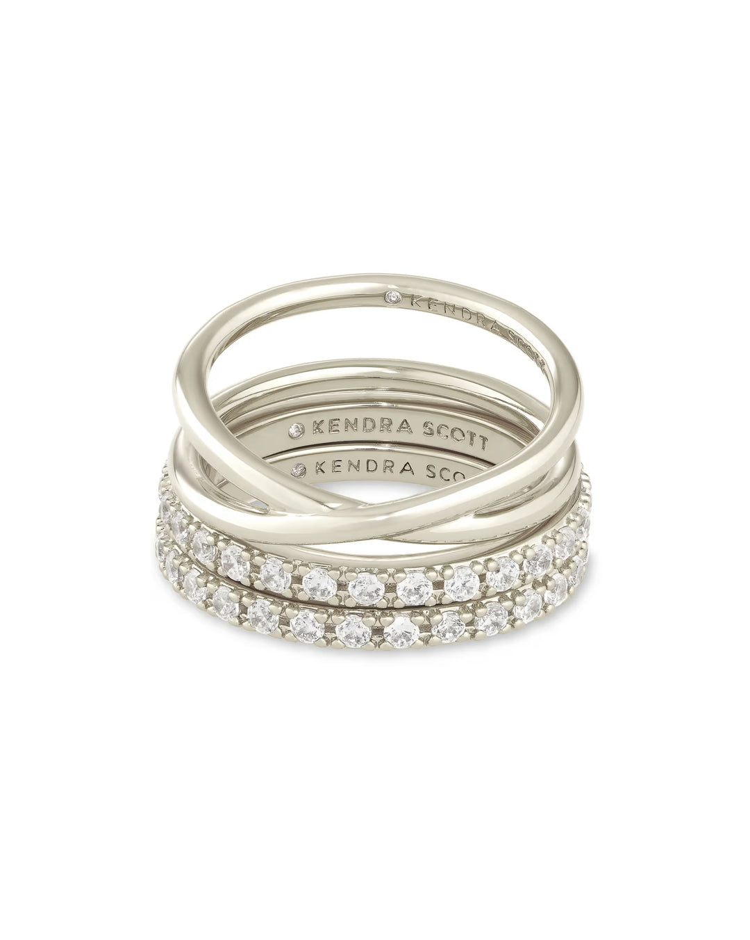 Livy Ring Set: three stackable silver bands, two with white crystals, one plain, all with "Kendra Scott" engraving. Sizes available.