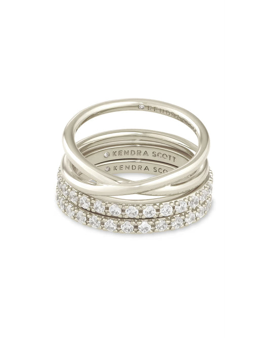 Livy Ring Set: three stackable silver bands, two with white crystals, one plain, all with "Kendra Scott" engraving. Sizes available.