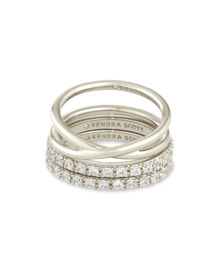 Livy Ring Set: three stackable silver bands, two with white crystals, one plain, all with "Kendra Scott" engraving. Sizes available.