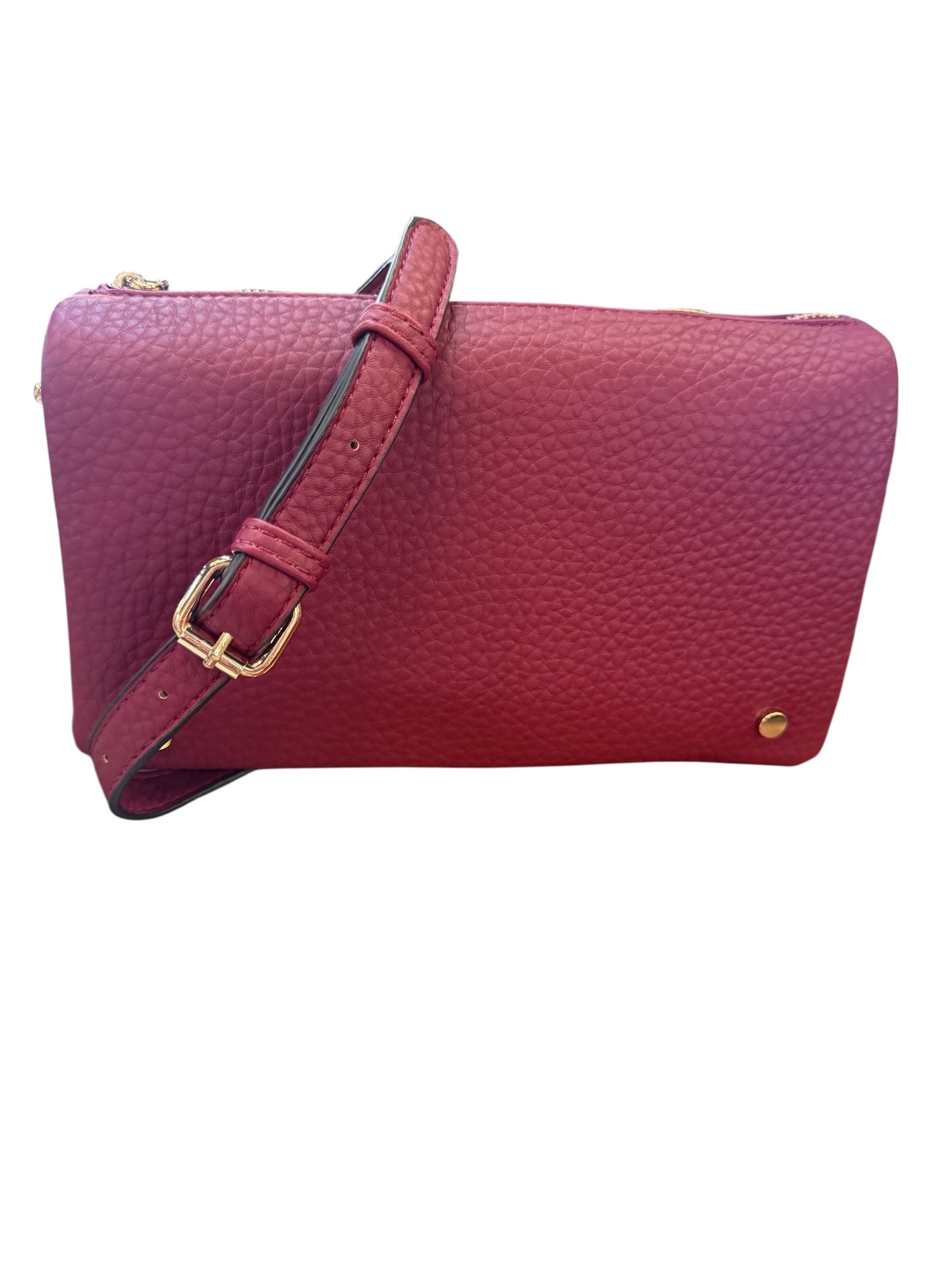 Textured maroon crossbody with gold buckle and stud. Adjustable strap. Available in small, medium, and large sizes.