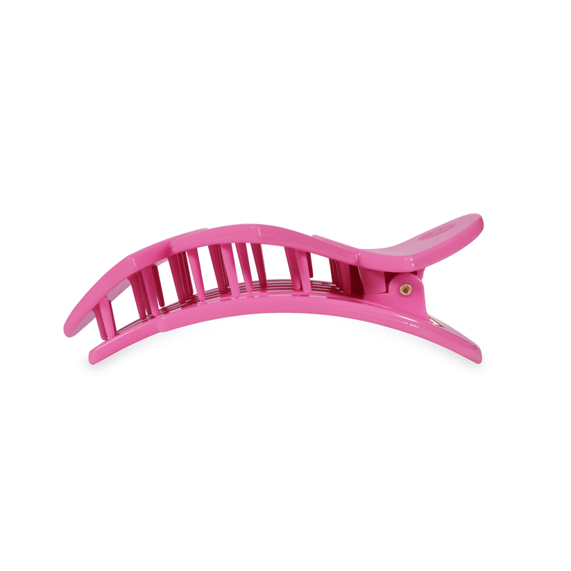 Pink plastic bendable hair clip with curved, vented design and hinge; available in multiple sizes; suitable for all hair types.