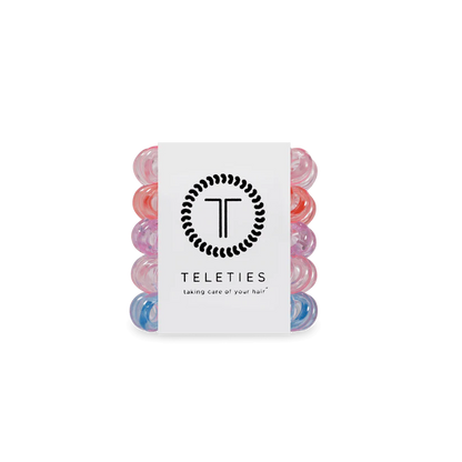 Pack of five colorful TELETIES Hair Ties with white logo labels; available in small, large, and tiny sizes.