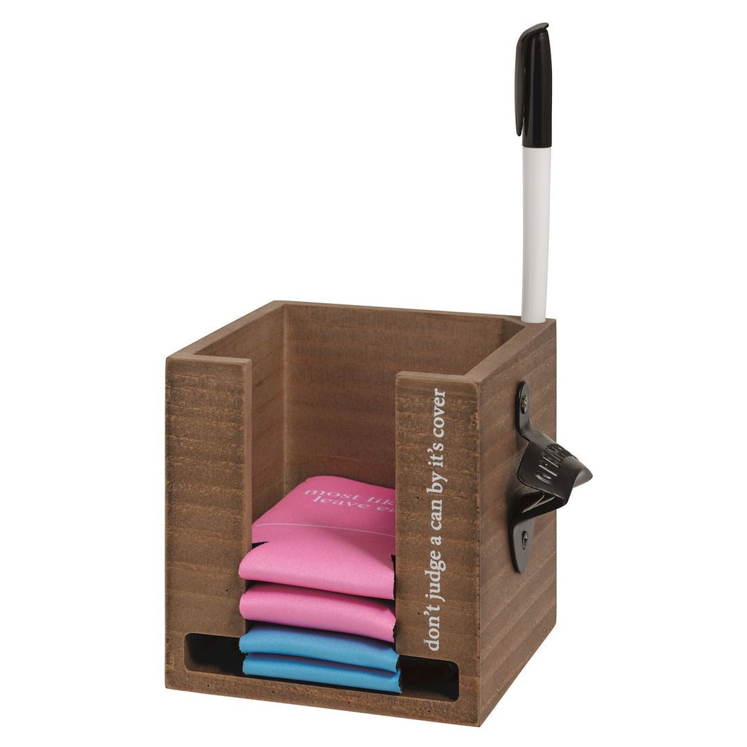 Wooden note holder with colorful sticky notes, black pen in top slot, and built-in pencil sharpener on the side. Features the phrase: “don’t judge a can by its cover.” Available in standard size.