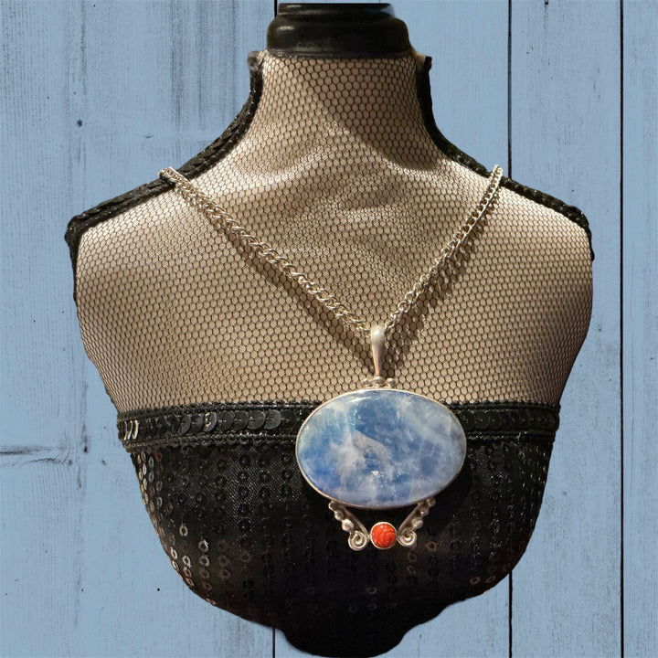 Sterling Silver Turquoise necklace with large oval turquoise pendant and small round orange accent. Available in 16", 18", 20".