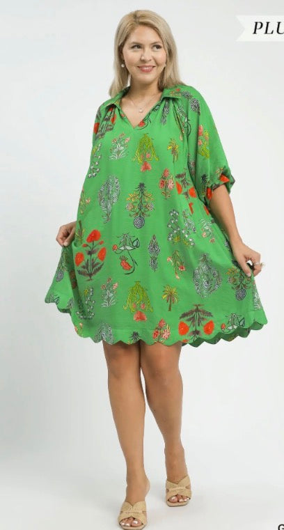 Floral Encyclopedia Print Mini Dress with relaxed fit, green botanical design, scalloped hem. Sizes: XS-XL.