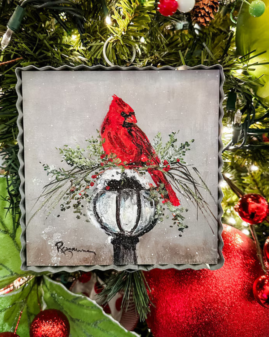 Mini Gallery Art Cardinal on Lamp Post: square Rozanne Priebe painting of a red cardinal on a snow-covered lamp post, framed in a scalloped metal border.