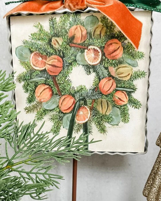 Mini Gallery Art Orange Slice Wreath with square metal-edged sign, evergreen, dried citrus, eucalyptus, and orange ribbon.