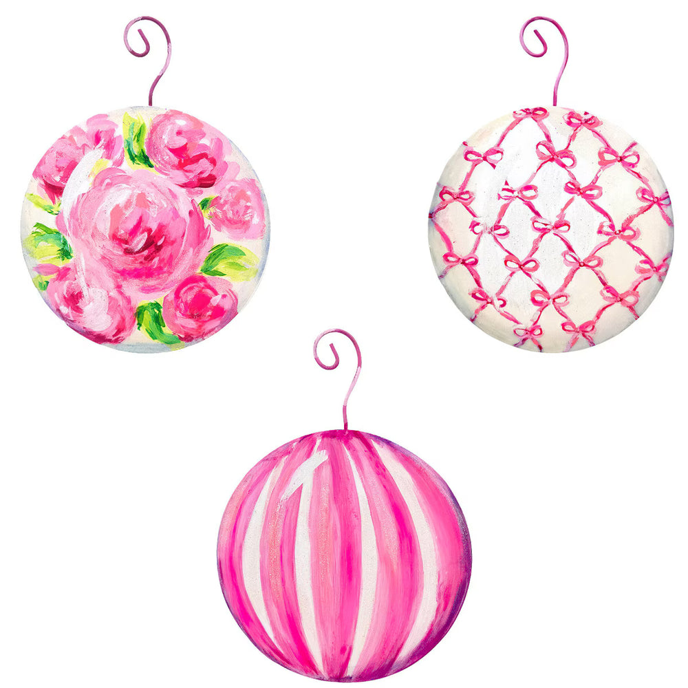 Three pink fanciful ball ornaments with rose, lattice, and stripe patterns.