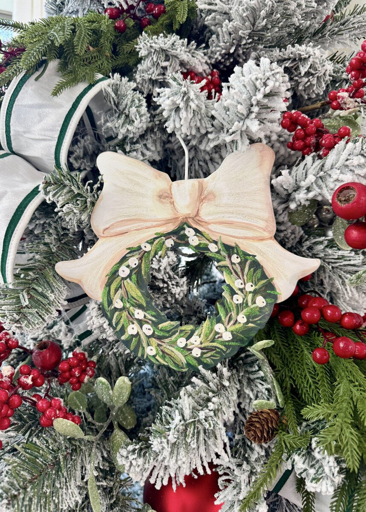 Elegant White Berry Wreath wooden Christmas tree ornament with cream-colored bow.