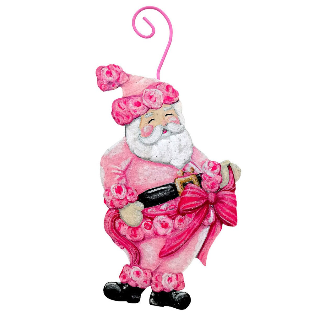 Fanciful Pink Santa Ornament in a pink, rose-patterned suit and matching hat, holding a red bow.