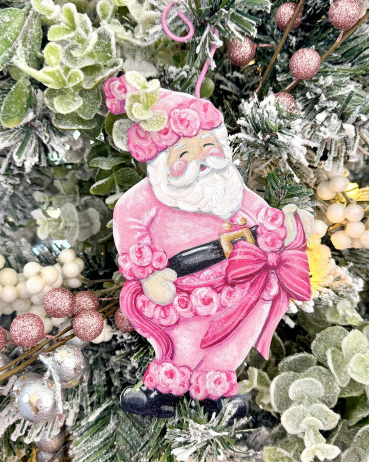 Fanciful Pink Santa Ornament with floral suit and large pink bow.