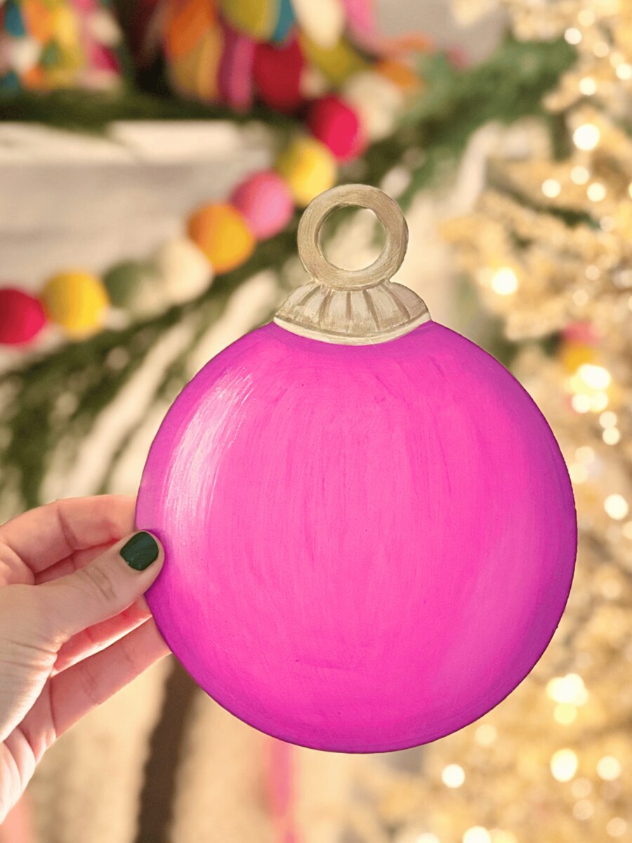 Bright pink Round Tree Ornament Magnet with tan cap and hanging loop.
