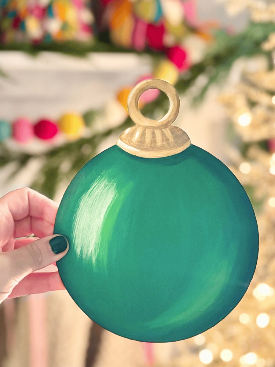 Green Round Tree Ornament Magnet with gold-colored cap.