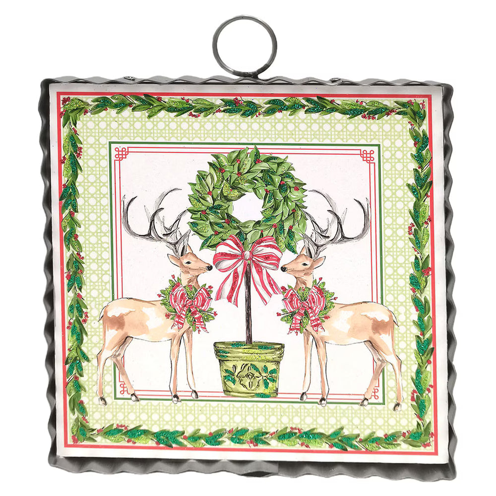 Mini Gallery Art Traditional Tidings Deer & Topiary square metal wall art with two deer, a potted topiary wreath, and a greenery border. Available in square.