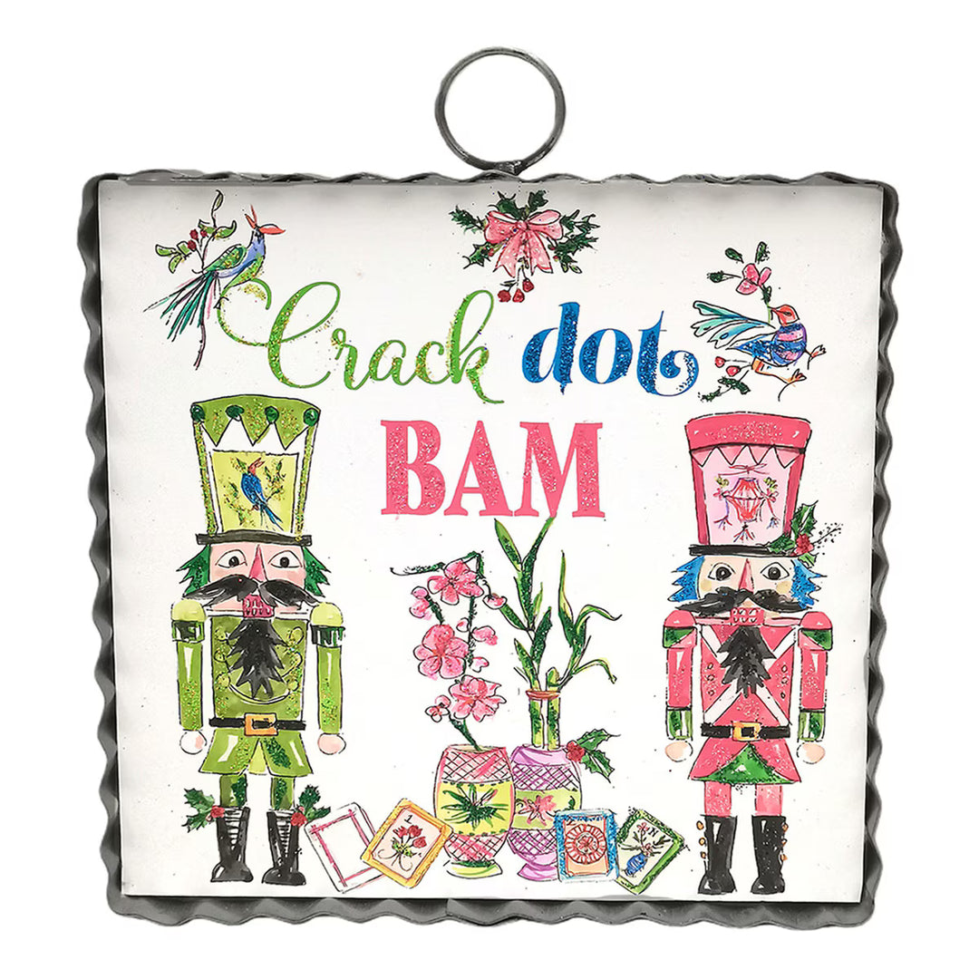 Square Mini Gallery Art “Crack dot BAM” metal sign featuring Rosanne Beck nutcrackers, vases with flowers, and Mahjong-inspired text.