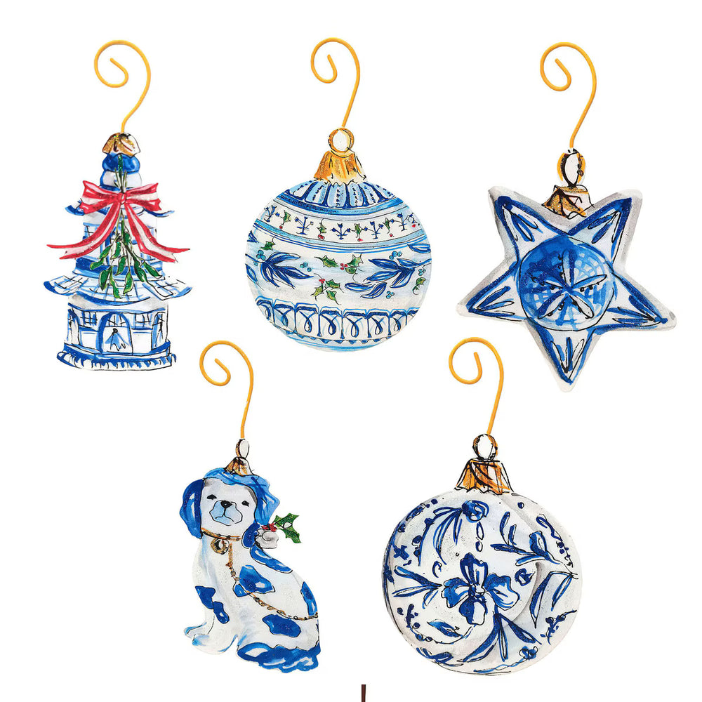 Five blue Beck’s Chinoiserie ornaments in 5 styles: pagoda, round bauble, star, dog, and floral sphere, each with a gold wire hanger.