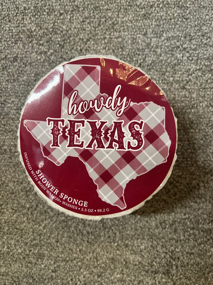 Round maroon shower sponge with white plaid Texas outline and "howdy TEXAS" text. Available in multiple sizes.