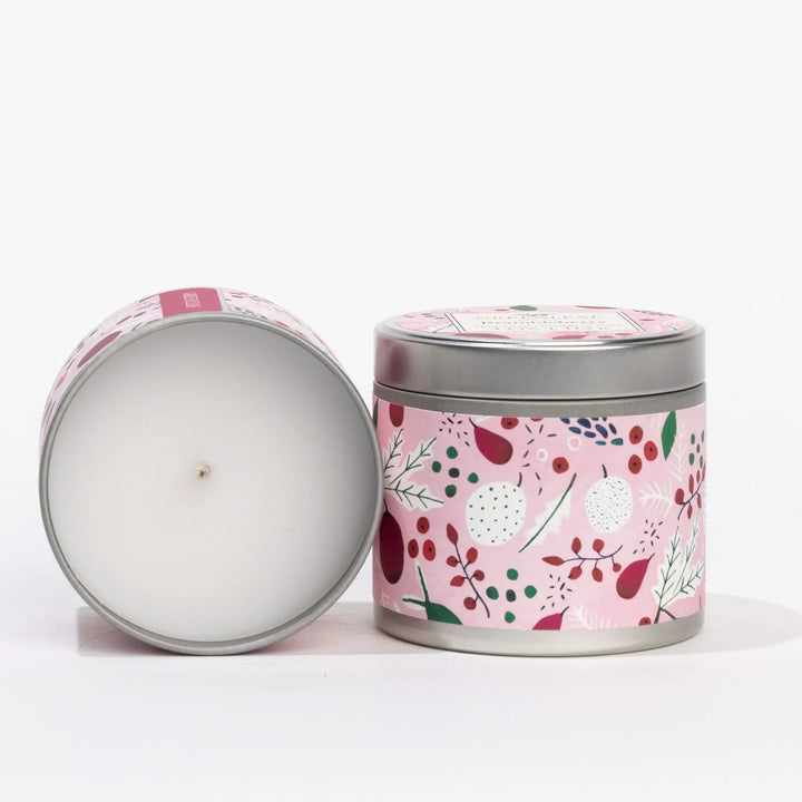 4oz Brambleberry candle tin in raspberry rose with a pink botanical label, shown closed and open with white wax.
