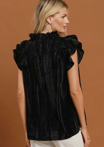 Velvet Ruffle Blouse: black velvet, sleeveless, ruffle sleeves, high neckline. Available in sizes XS–XL.