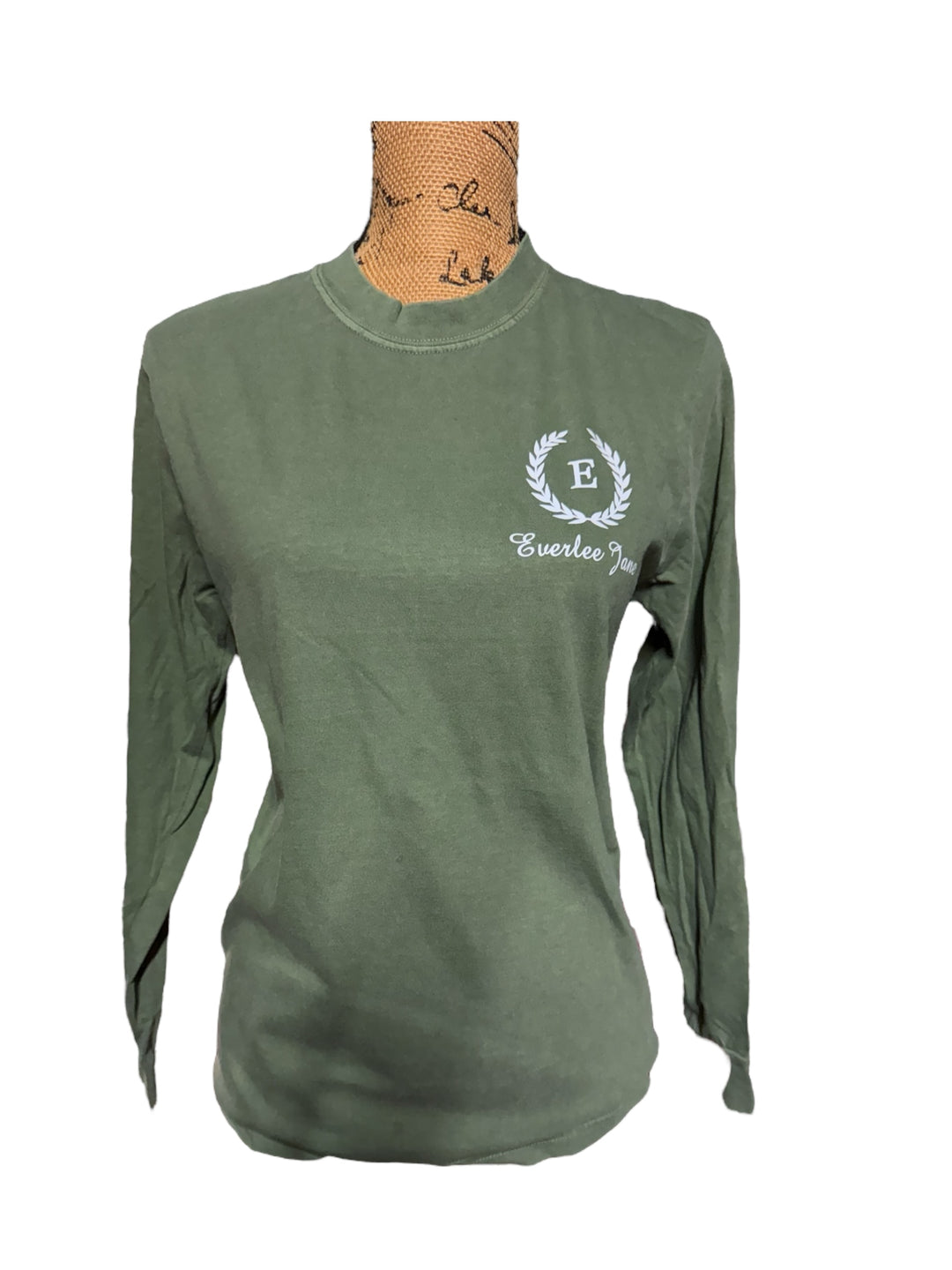 Unisex deep green long sleeve cotton tee with white "E" in laurel wreath, "Everlee Jane" below. Sizes: S-XXL.