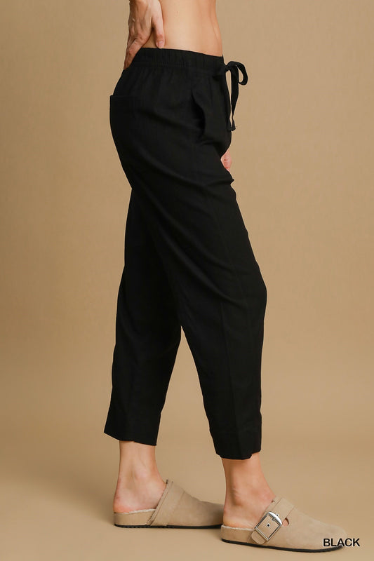 Black Linen Blend Pull-On Pant with stretch fabric, elastic waistband, and tie detail. Available sizes: XS, S, M, L, XL.