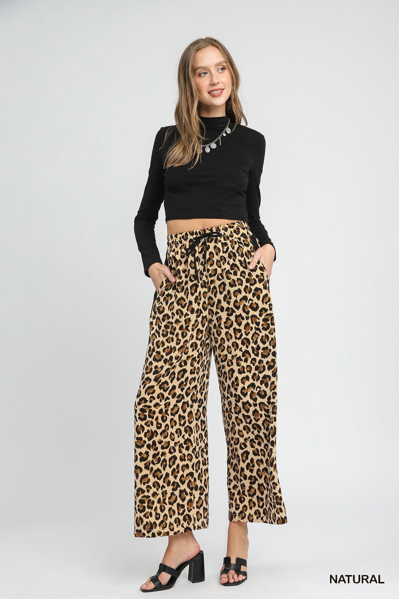 Leopard Print Wide-Leg Drawstring Pants. Available in sizes XS–XL. Relaxed fit, flowy silhouette, adjustable waist.