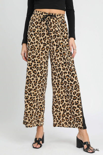 Leopard Print Wide-Leg Drawstring Pants. Sizes: XS-XL. Relaxed fit, ideal for lounging.