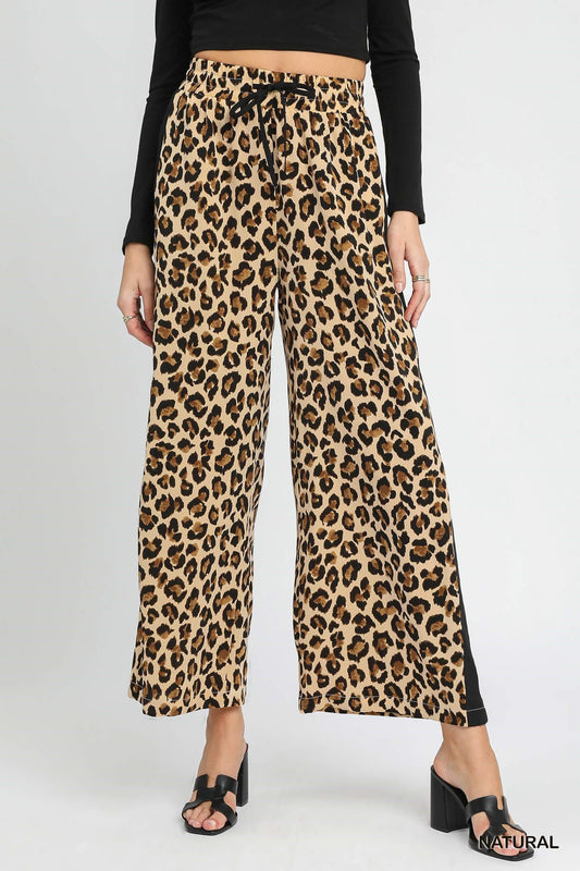 Leopard Print Wide-Leg Drawstring Pants. Sizes: XS-XL. Relaxed fit, ideal for lounging.