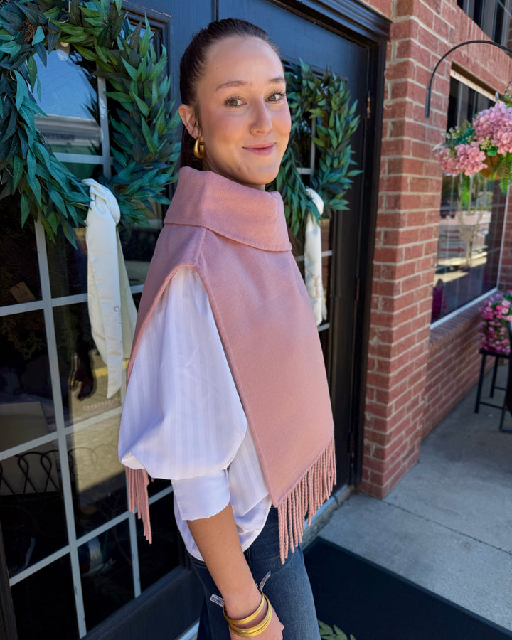 Blush collar poncho with fringe, high collar, and fringed hem. Available in multiple sizes.