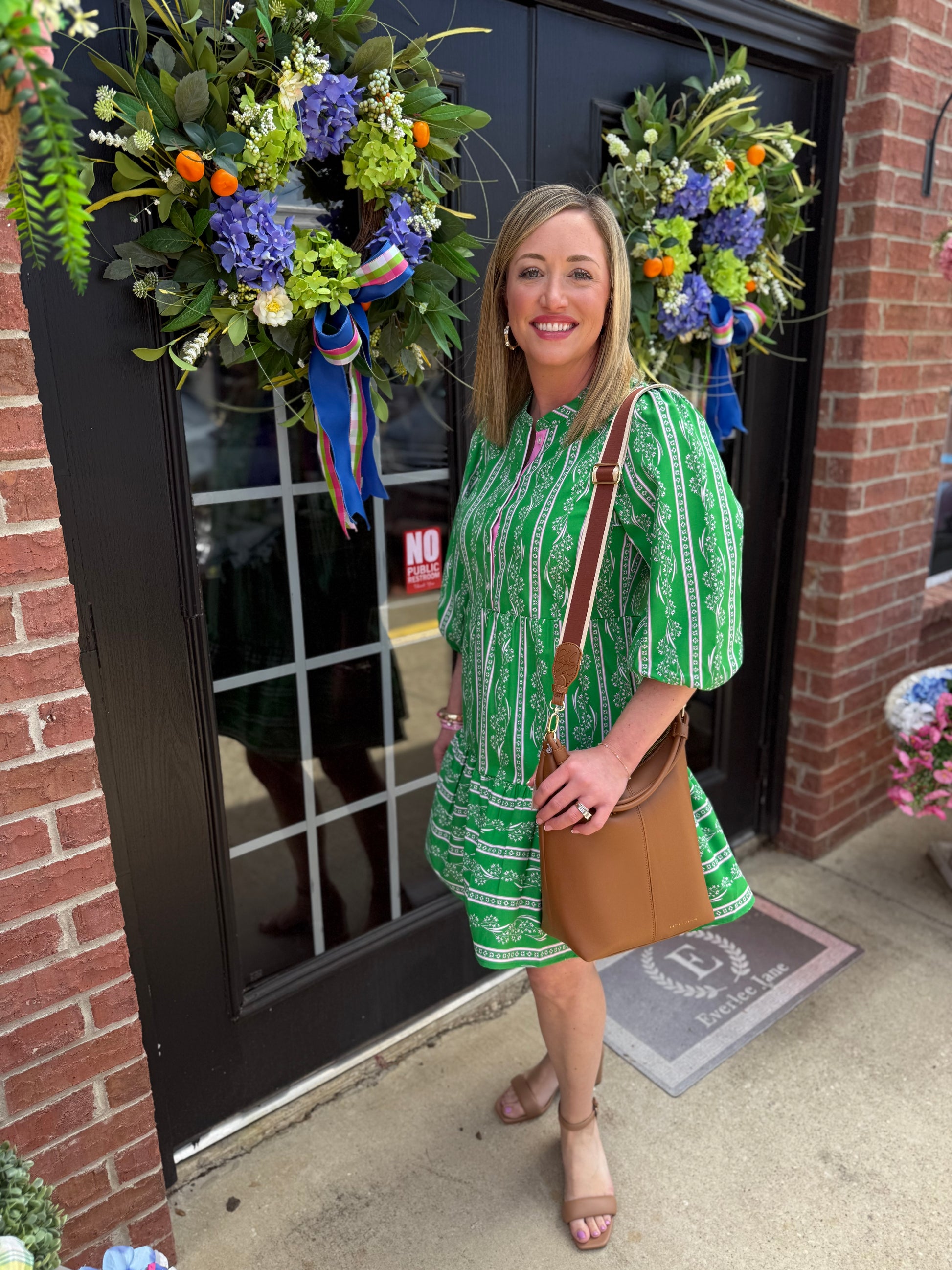 Riley Garden Lace Green Dress with tiered skirt; available in sizes XS-XL.