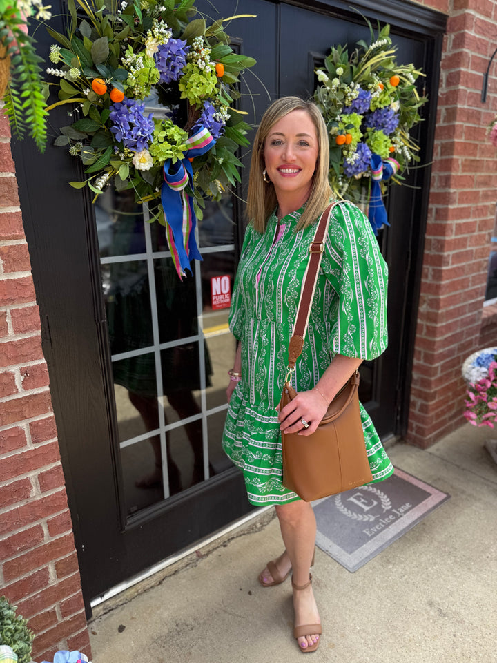 Riley Garden Lace Green Dress with tiered skirt; available in sizes XS-XL.