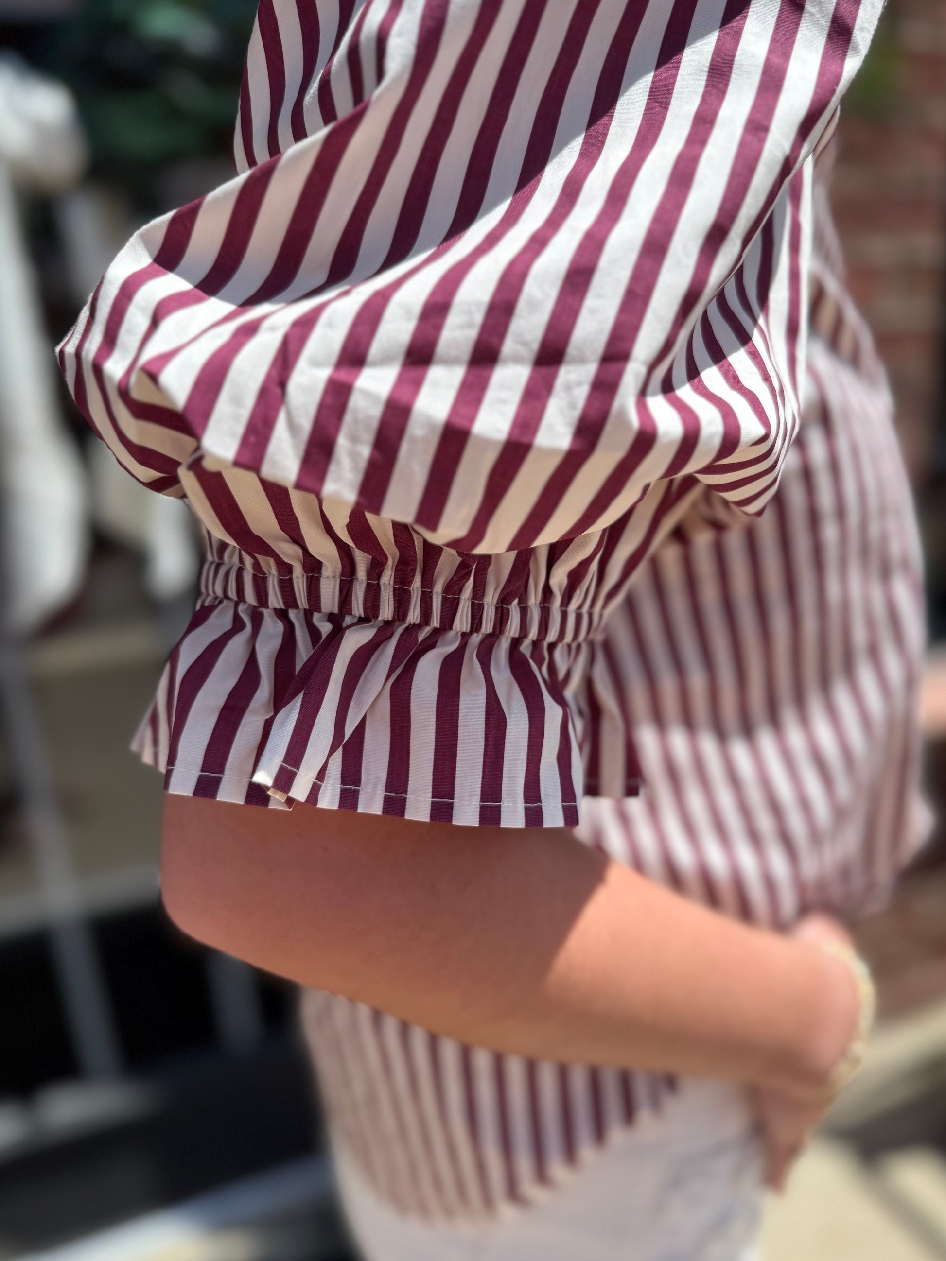Maroon Striped Cinched Blouse with cinched waist detail. Available in sizes XS to XL.