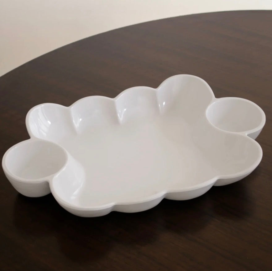 The VIDA Havana Double Dip is a white ceramic serving tray with a cloud-inspired shape and three round compartments. Available sizes: small, medium, and large.