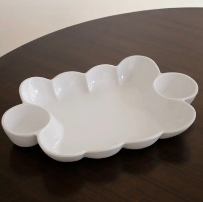 The VIDA Havana Double Dip is a white ceramic serving tray with a cloud-inspired shape and three round compartments. Available sizes: small, medium, and large.