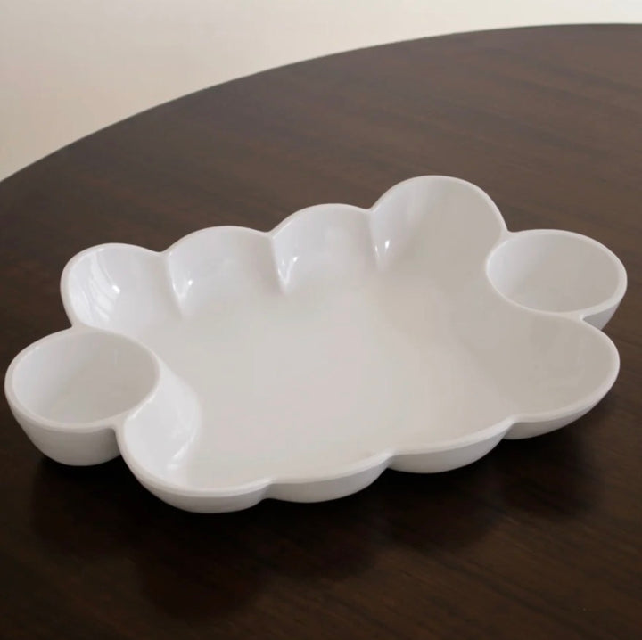 The VIDA Havana Double Dip is a white ceramic serving tray with a cloud-inspired shape and three round compartments. Available sizes: small, medium, and large.