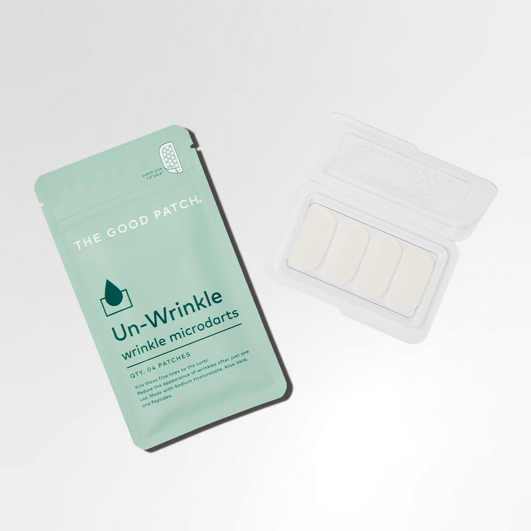 Teal "Unwrinkle Patch" pouch with three white microdart patches for fine lines; available in small, medium, large.
