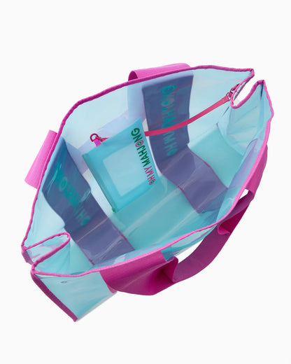 The Mahjong Beach Bag has a pink handle, translucent blue body, roomy main compartment, and small inner zippered pocket. Available in sizes small, medium, and large.