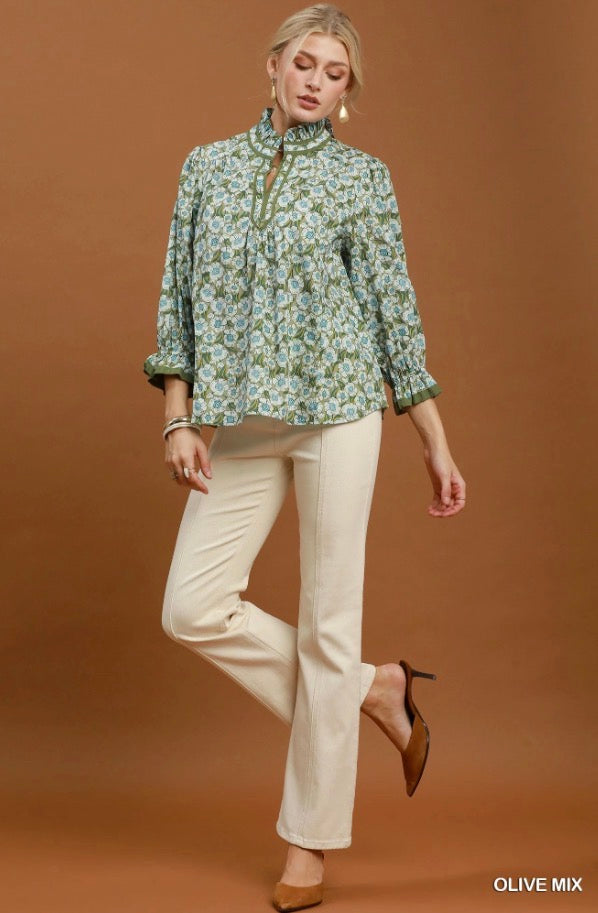 Floral Mandarin Collar Blouse with green floral pattern and ruffled collar. Available in sizes XS-XL.
